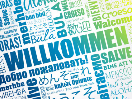 Willkommen (Welcome in German) word cloud in different languages, conceptual background